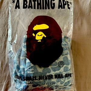 New with tags. APEE. By A Bathing Ape Size S. Never worn. Stored in Bag.